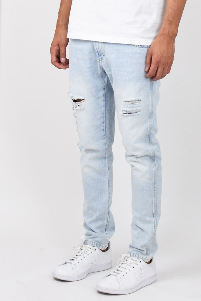 Light Stonewashed Ripped Tapered Jeans – ENSLAVED